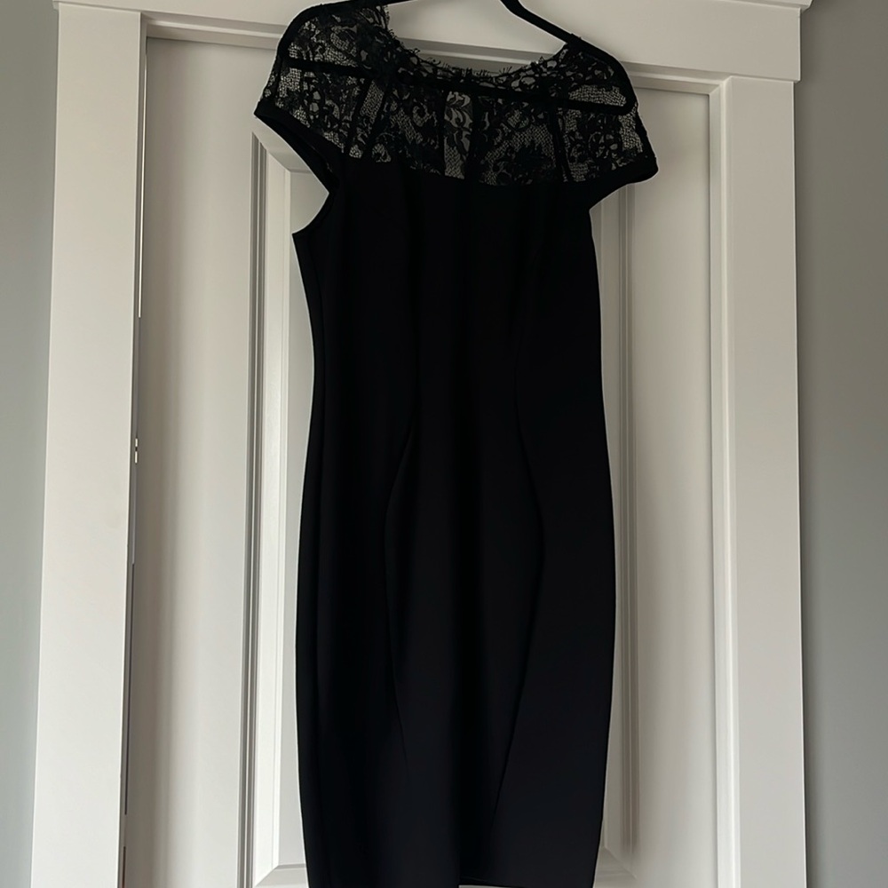 Woman’s black cocktail dress